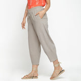 Left View of a Model wearing Yarn Dyed Cotton Beige Paneled Pant