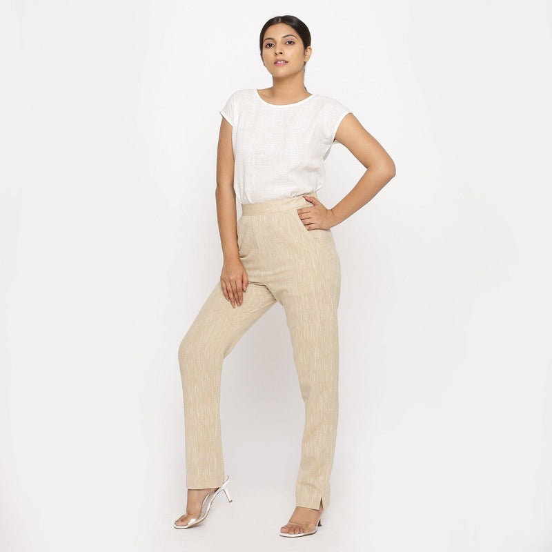 Front View of a Model wearing Beige Yarn Dyed Mid Rise Tapered Pant