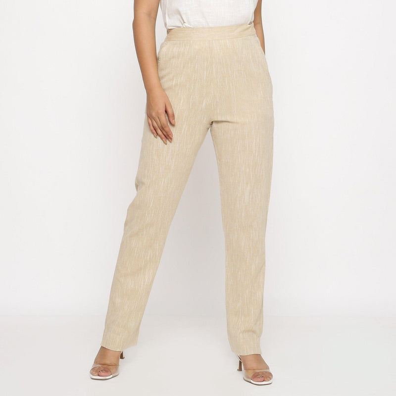 Front View of a Model wearing Beige Yarn Dyed Mid Rise Tapered Pant