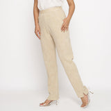 Left View of a Model wearing Beige Yarn Dyed Mid Rise Tapered Pant