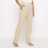 Right View of a Model wearing Beige Yarn Dyed Mid Rise Tapered Pant