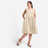 Front View of a Model wearing Yarn Dyed Cotton Beige Yoke Dress