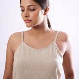 Front Detail of a Model wearing Solid Beige Cotton Flax Spaghetti Top