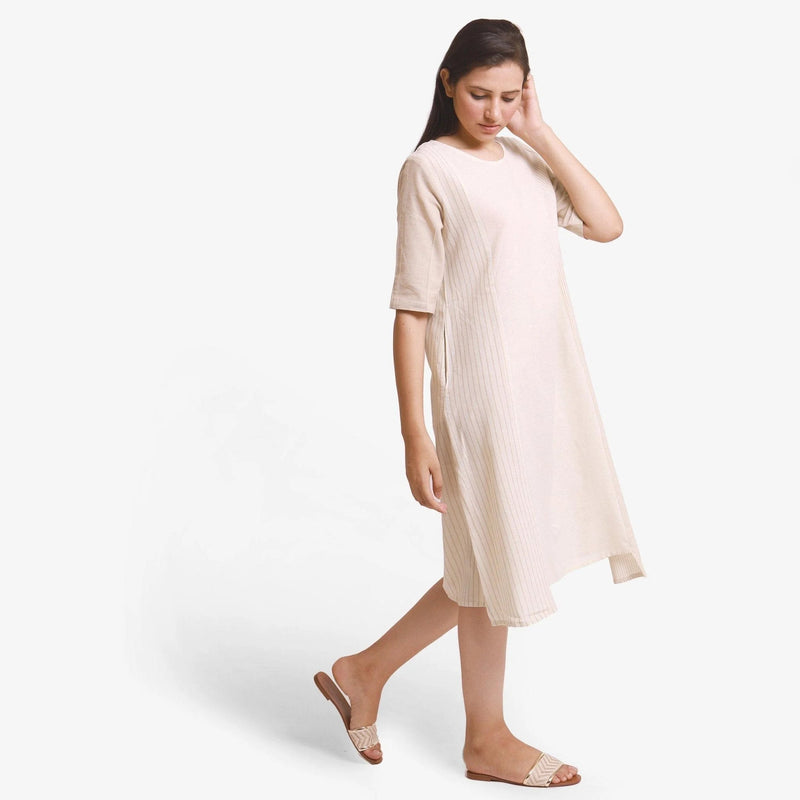 Right View of a Model wearing Beige Yarn Dyed Cotton Paneled Dress