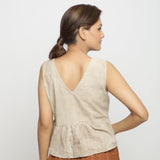 Back View of a Model wearing Beige Dabu Printed Sleeveless Gathered Top