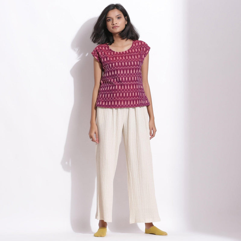 Front View of a Model wearing Handwoven Ikat Berry Wine Straight Top