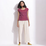 Front View of a Model wearing Berry Wine Handwoven Cotton Ikat Round Neck Cap Sleeve Top