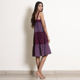 Right View of a Model wearing Berry Wine Striped Cotton Knee Length Tier Dress