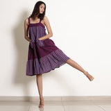 Front View of a Model wearing Berry Wine Striped Cotton Knee Length Tier Dress