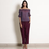 Front View of a Model wearing Berry Wine Striped Off-Shoulder Frilled Top