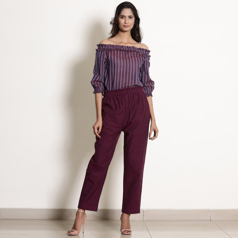 Front View of a Model wearing Berry Wine Striped Cotton Off-Shoulder Frilled Top