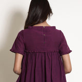 Back View of a Model wearing Warm Berry Wine Gathered Frilled Top