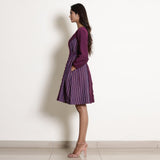 Left View of a Model wearing Warm Berry Wine Frilled Paneled Dress