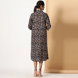 Back View of a Model wearing Black Bagru Block Printed Button-Down Dress