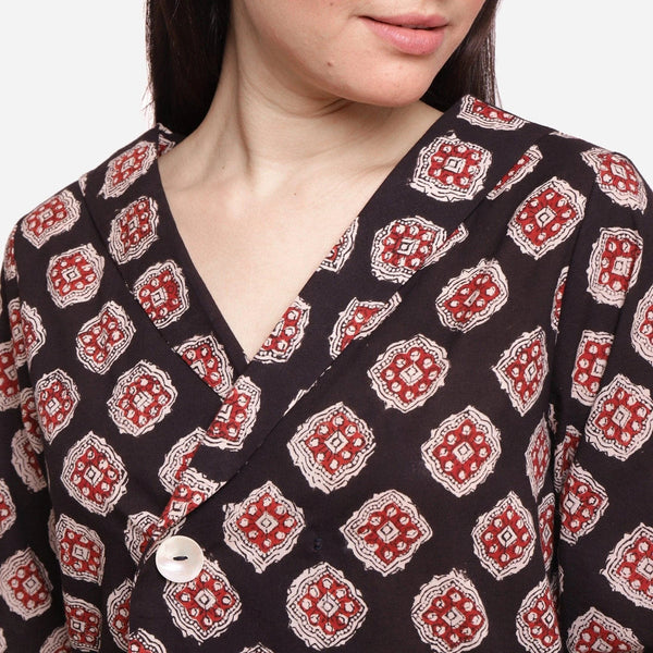 Front Detail of a Model wearing Black Bagru-Printed Shawl Collar Top