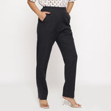 Right View of a Model wearing Cotton Flax Mid-Rise Black Tapered Pant