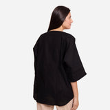 Back View of a Model wearing Black Loose Fit Drop Shoulder Top