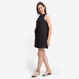 Left View of a Model wearing Black Cotton Flax Kangaroo Pocket Dress