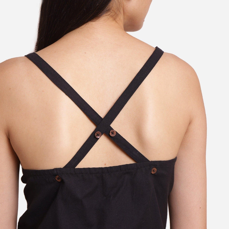 Back Detail of a Model wearing Solid Black Criss-Cross Tank Top