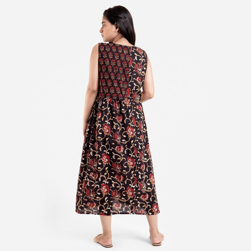 Back View of a Model wearing Floral Bagru Sleeveless Yoke Dress