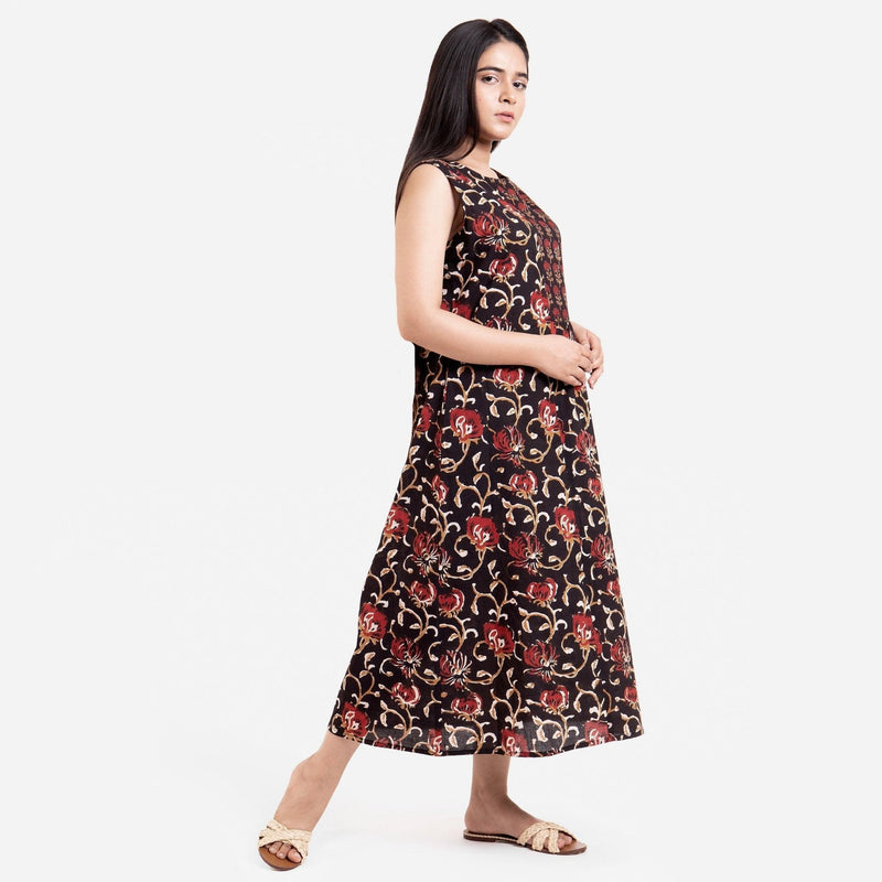 Right View of a Model wearing Black Floral Block Print Cotton Yoke Maxi Dress