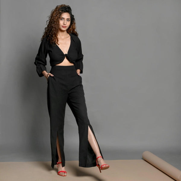 Right View of a Model wearing Black Tie-up Crop Top and Slit Pant Set