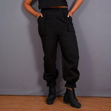 Front View of a Model wearing Black Warm Cotton Flannel High-Rise Convertible Jogger Cargo Pant