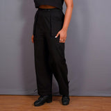 Left View of a Model wearing Black Warm Cotton Flannel High-Rise Convertible Jogger Cargo Pant