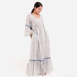 Right View of a Model wearing Blue Block Printed Bell Sleeves Tier Dress