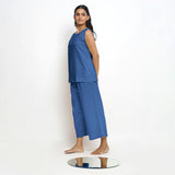 Left View of a Model wearing Blue Boat Neck Top and Powder Blue Pant Set