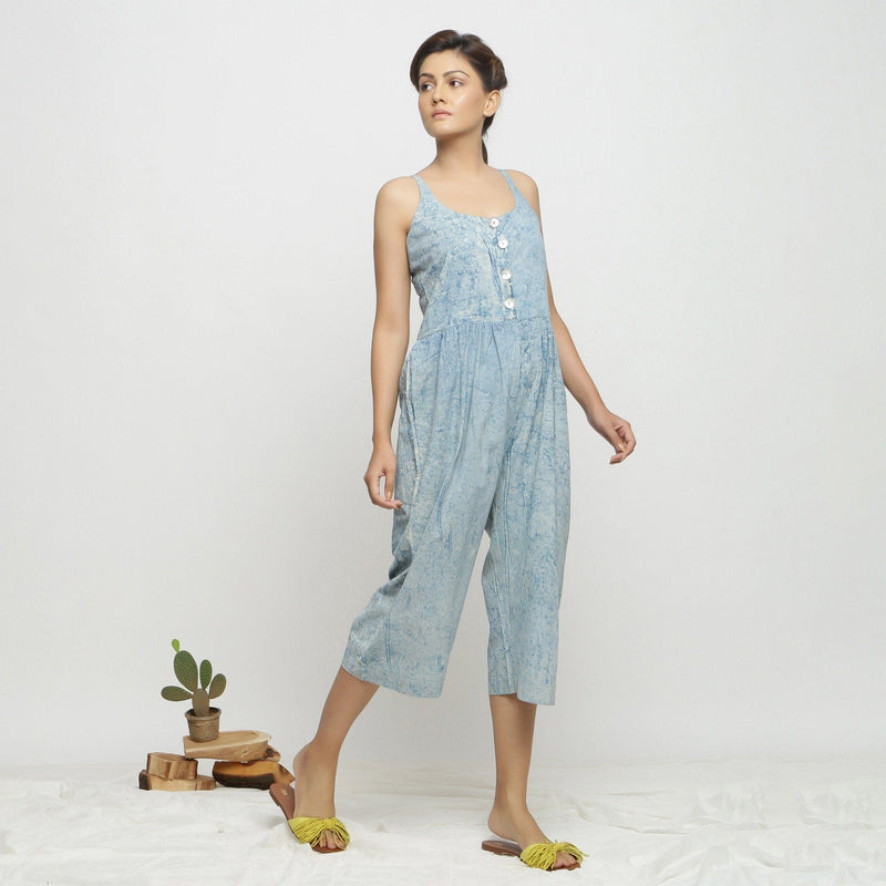 Right View of a Model wearing Blue Dabu Printed Button-Down Jumpsuit