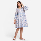 Front View of a Model wearing Blue Floral Fit and Flare Cotton Dress