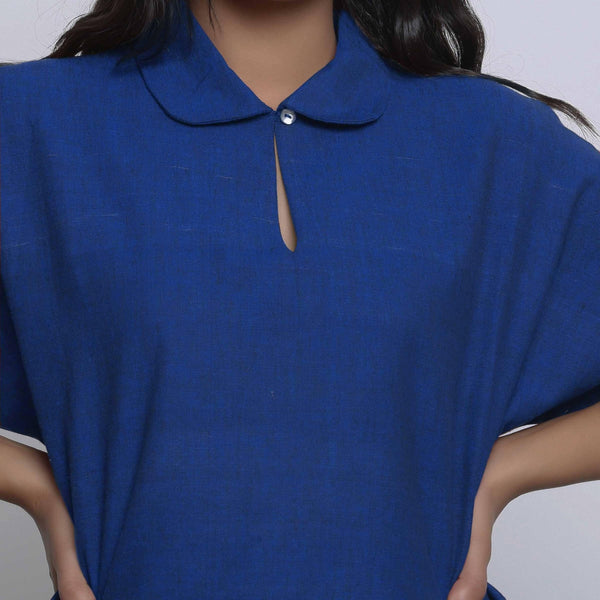 Front Detail of a Model wearing Blue Round Collar Straight Top