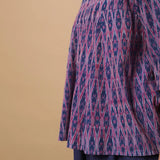 Left Detail of a Model wearing Blue Handwoven Cotton Ikat Godet Flared Top