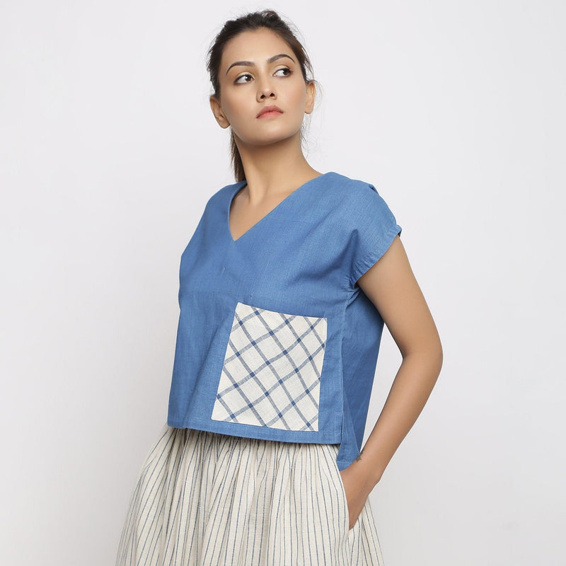 Left View of a Model wearing Vegetable Dyed Cotton Blue High Low Top