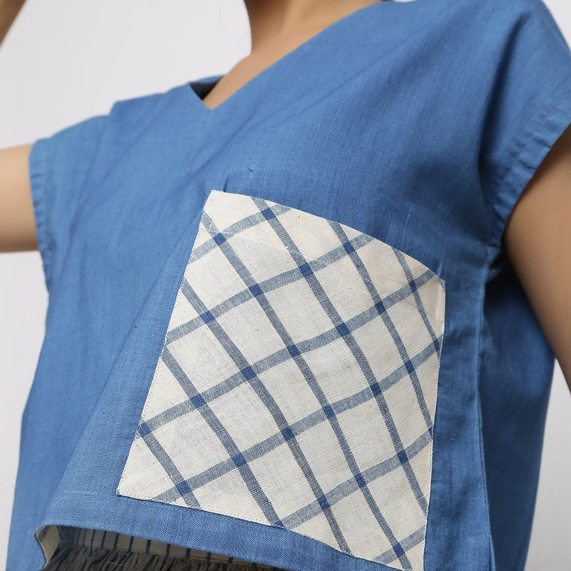 Left Detail of a Model wearing Vegetable Dyed Cotton Blue High Low Top