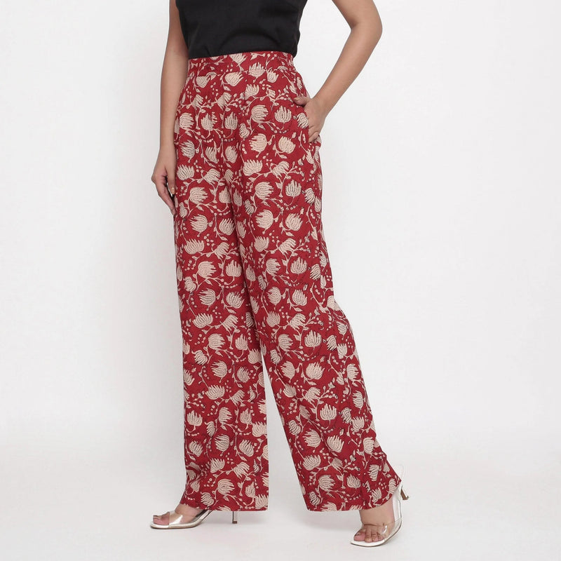 Left View of a Model wearing Brick Red Block Print Wide Straight Cotton Pant