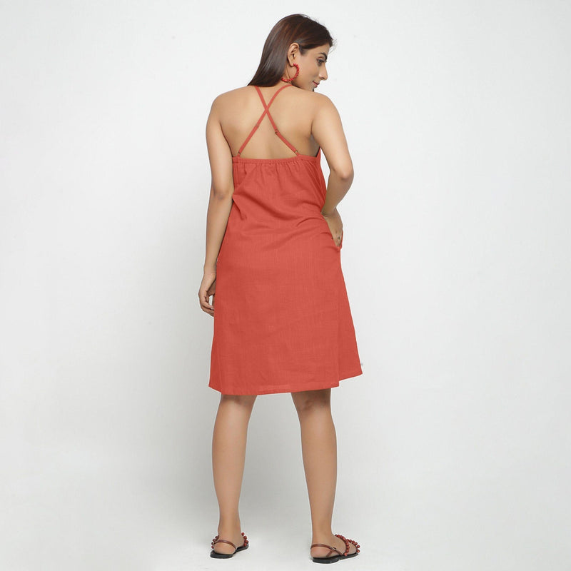 Back View of a Model wearing Brick Red Criss-Cross Cotton A-Line Dress