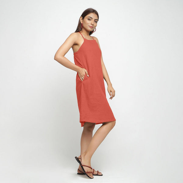 Right View of a Model wearing Brick Red Criss-Cross Cotton A-Line Dress