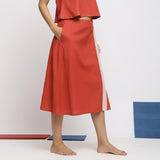 Right View of a Model wearing Brick Red Vegetable Dyed Handspun Cotton Button-Down Midi Skirt