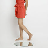 Left View of a Model wearing Brick Red Vegetable Dyed Handspun Short Shorts