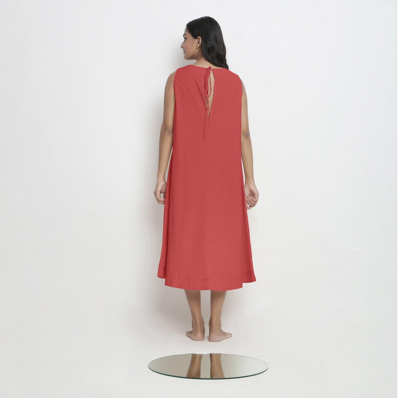 Back View of a Model wearing Brick Red Vegetable Dyed A-Line Paneled Dress