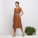 Left View of a Model wearing Brown Handspun V-Neck Shift Dress