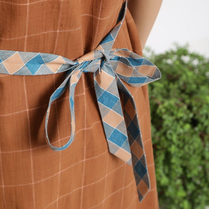 Back Detail of a Model wearing Brown Handspun V-Neck Shift Dress