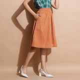 Right View of a Model wearing Brown Handspun Flared Knee Length Skirt