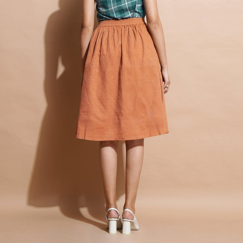 Back View of a Model wearing Brown Handspun Flared Knee Length Skirt