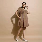 Right View of a Model wearing Handspun Brown Drop Shoulder Yoke Dress