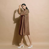 Left View of a Model wearing Handspun Brown Paneled Loose Fit Dress