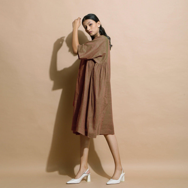 Left View of a Model wearing Handspun Brown Paneled Loose Fit Dress