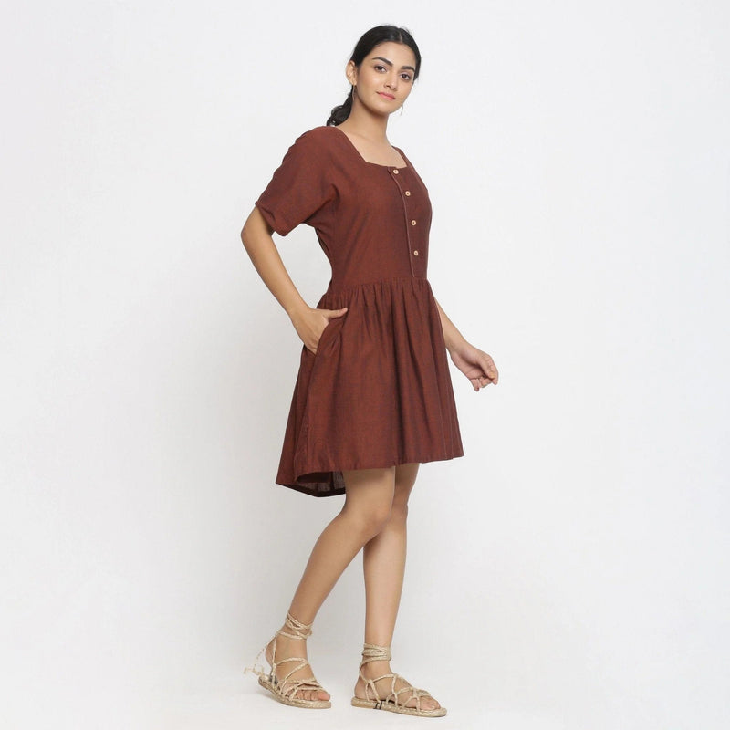 Right View of a Model wearing Brown Cotton Button-Down Gathered Dress